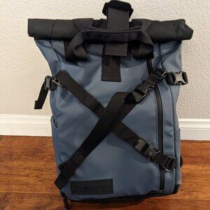 WANDRD PRVKE 21l backpack with camera cube, hip straps, and accessory straps
